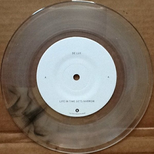 De Lux - Life In Time Gets Narrow (7", RSD, Single, Clear/Black)